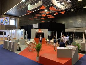 Front view of a modern stand with custom lighting and decor