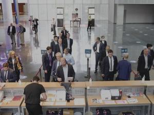 Business meeting with chairs, a lectern, and audiovisual projection managed by Lankor